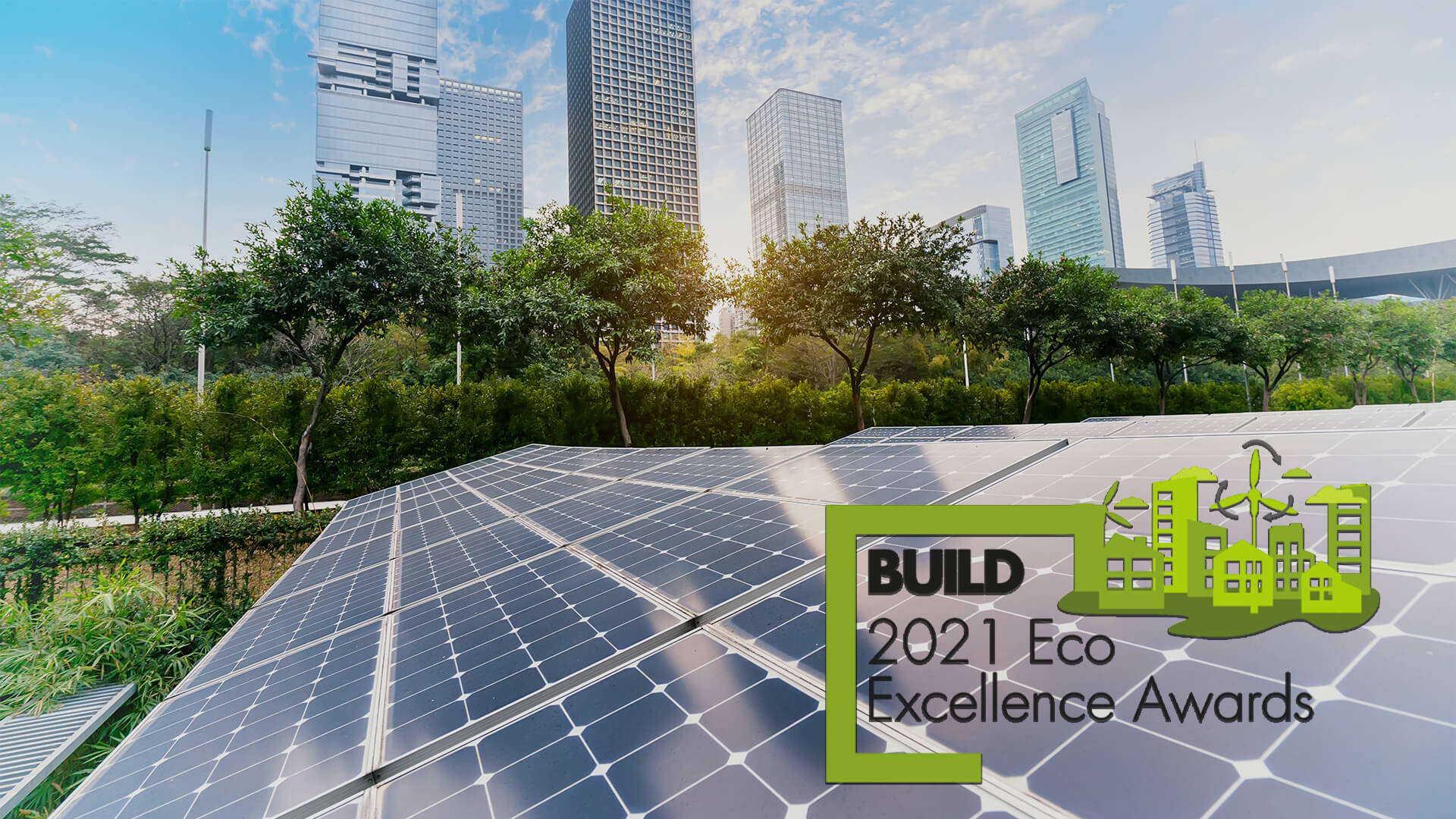 Build Eco Excellence Awards 2021 logo with a city skyline in the background, and solar panels