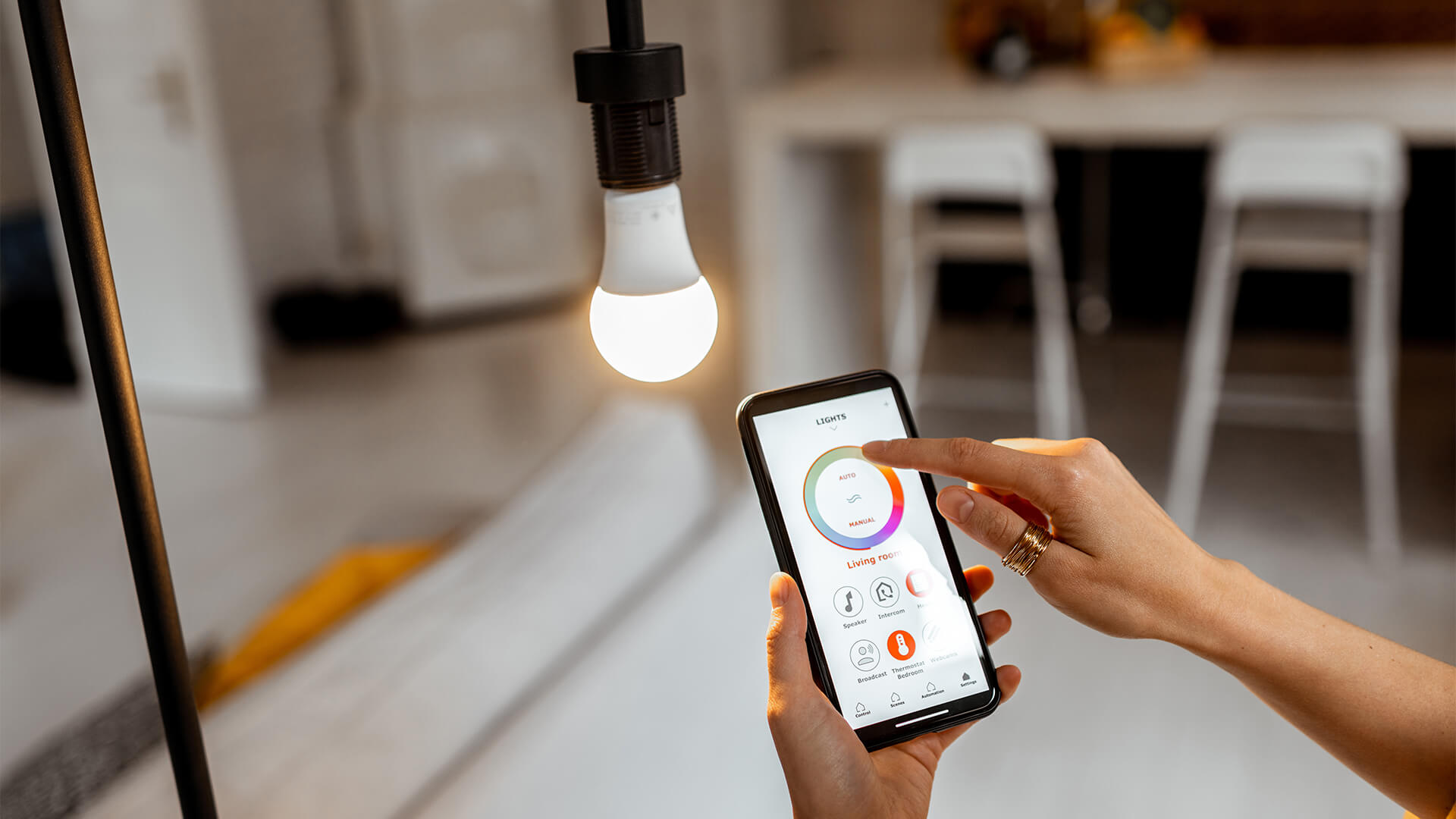 LED smart bulb being used through bluetooth on a mobile phone device