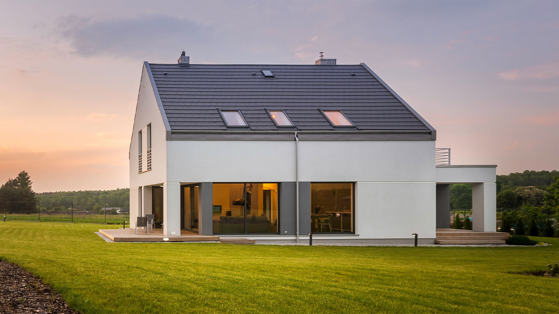 Modern kit home in the countryside at sunset