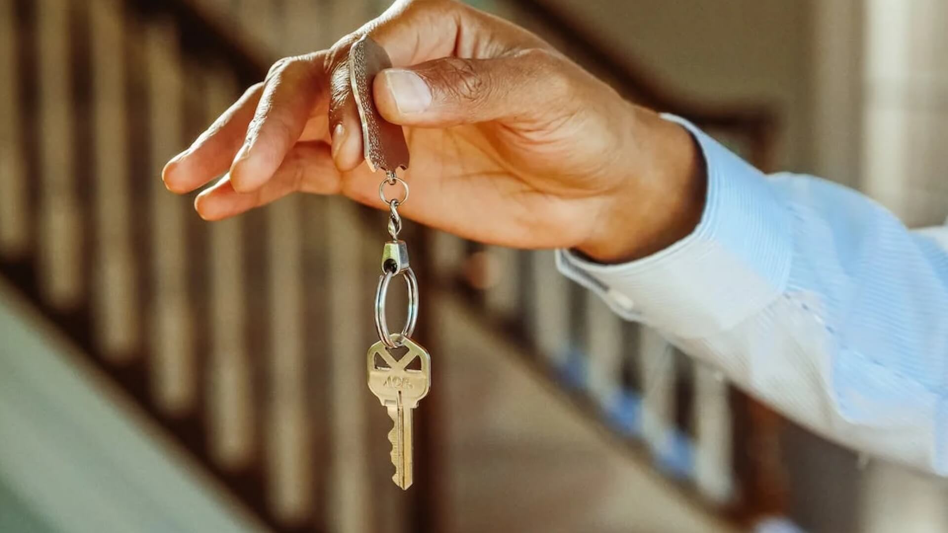 person holding a set of keys