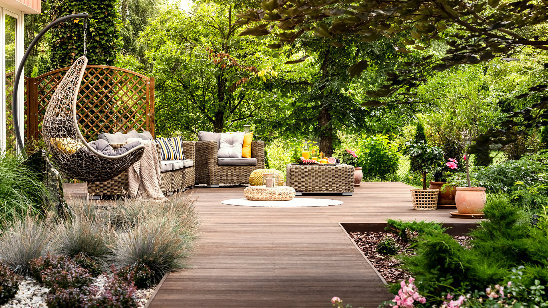 Wooden terrace surrounded by greenery