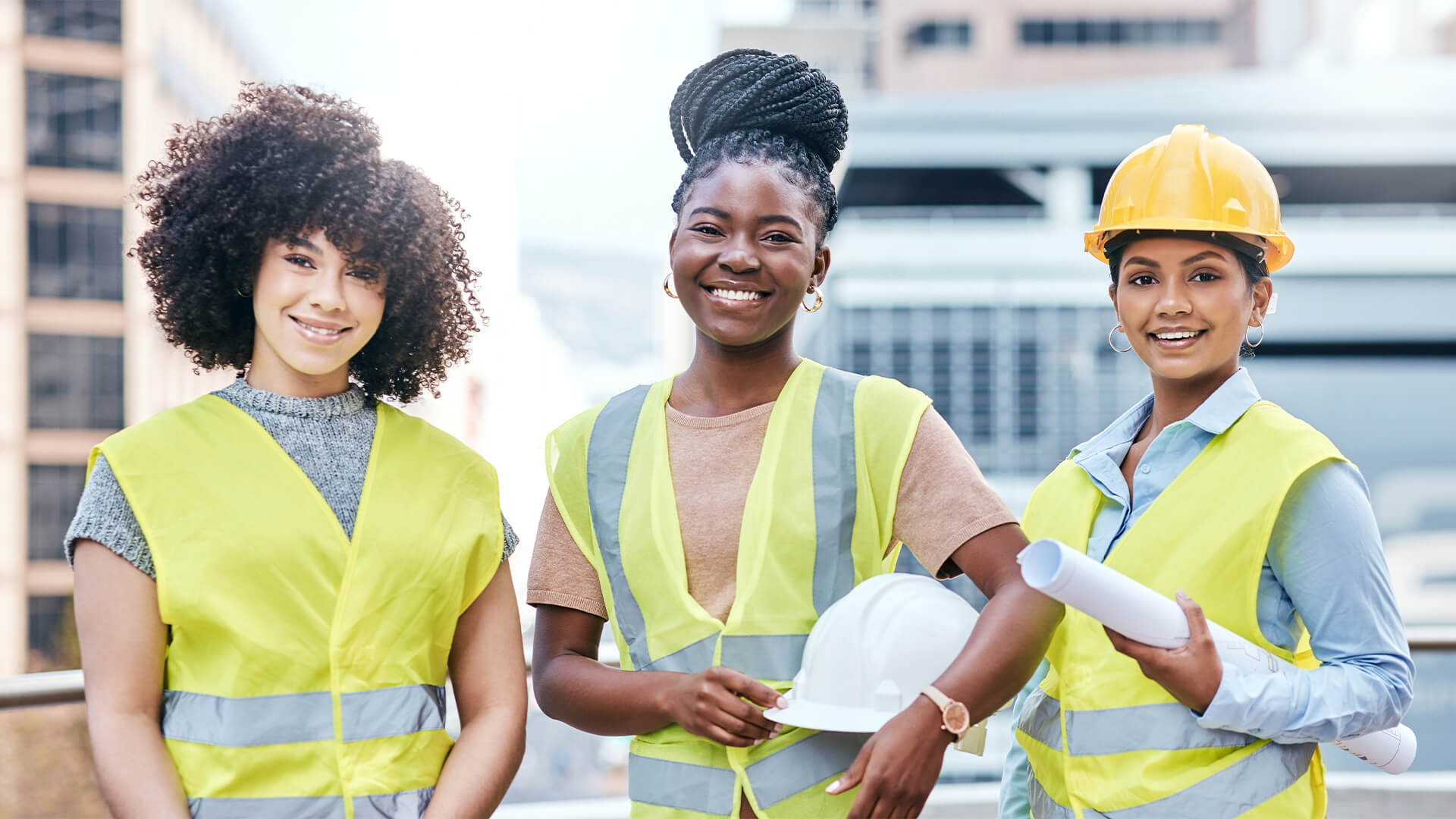 Portrait of a group of confident young businesswomen working at a construction site.