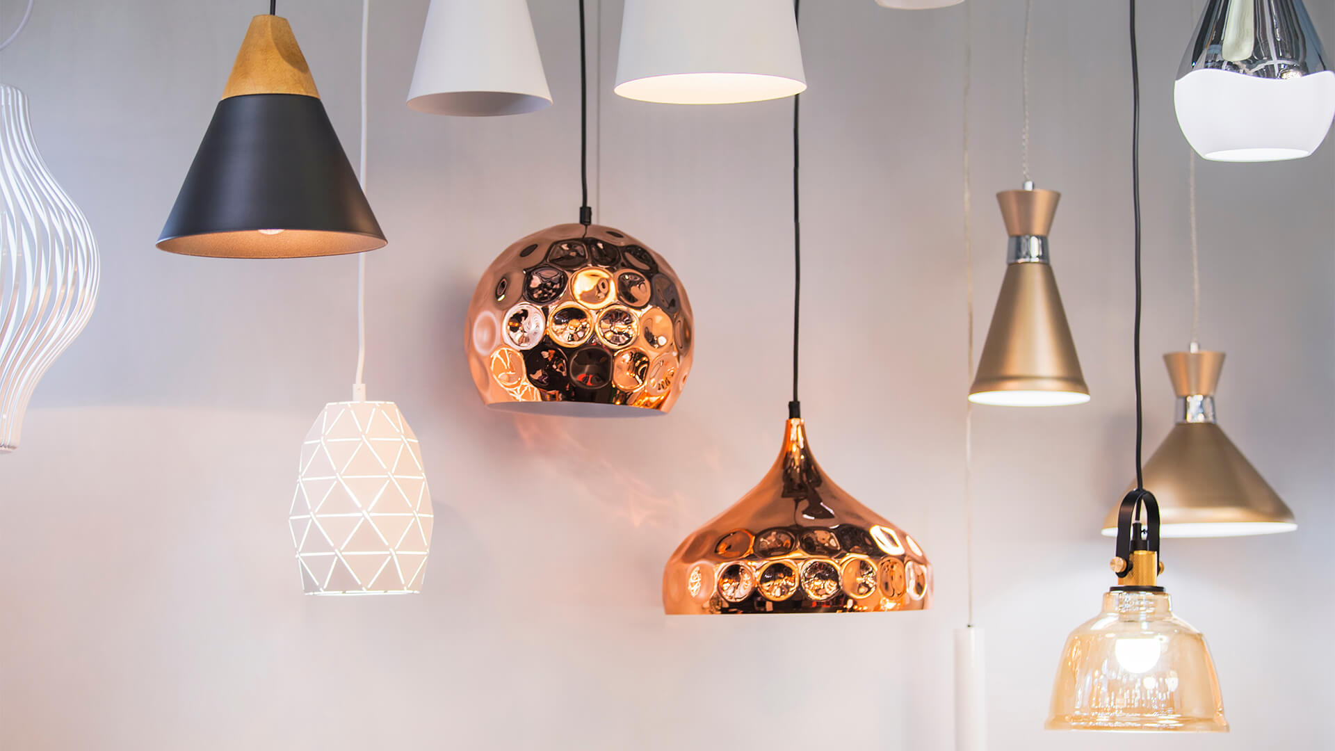 Different modern streamlined mirror copper chandeliers