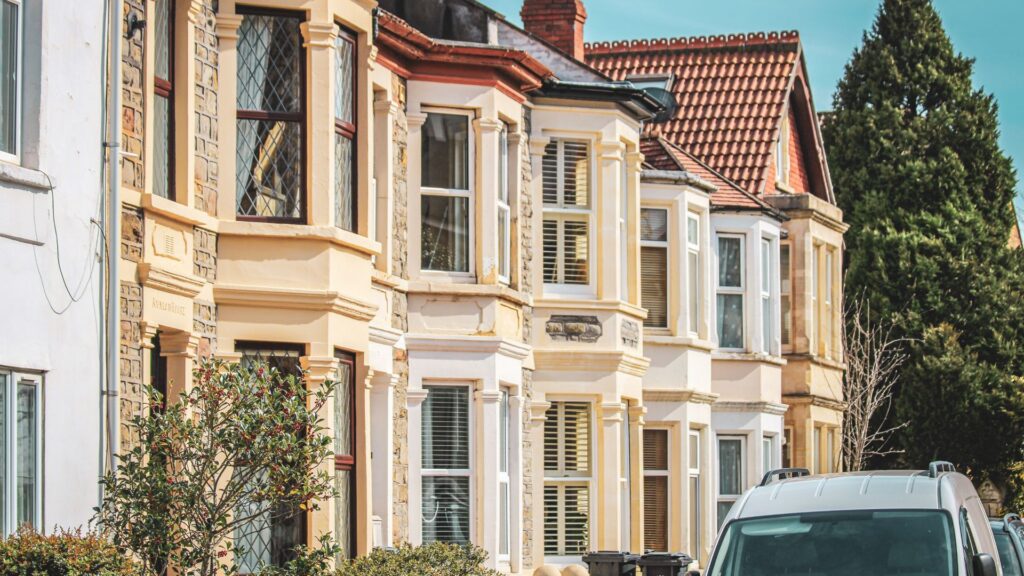 A side-on view of a row of terraced houses complete with bay windows.